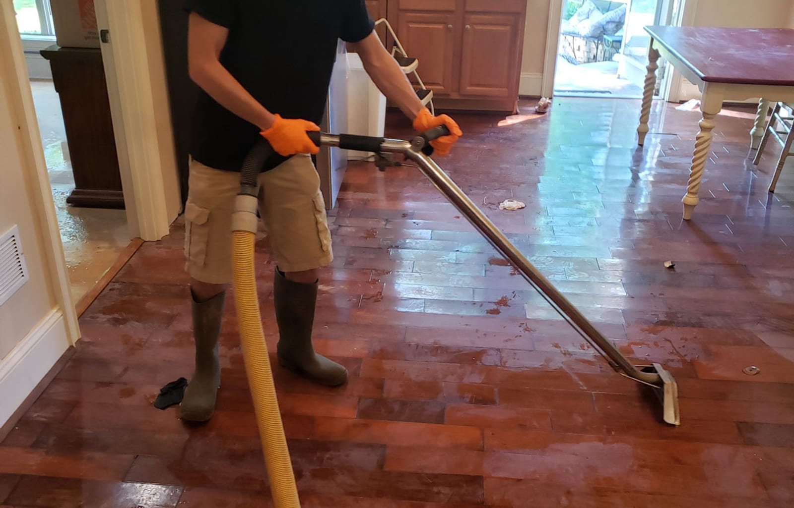 Water extraction from hardwood floors — rapid mitigation prevents further damage